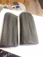 Two black nylon headrest pillows top view