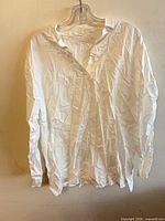 Front view of white 4XL long-sleeve shirt on hanger