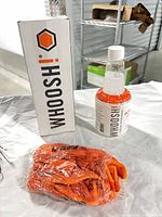 Bottle, cloth and box on table