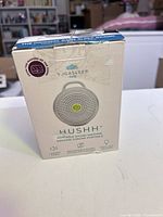 Front of Yogasleep Hushh sound machine retail box showing tape and creases