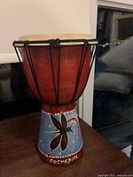 Full view of djembe drum showing painted butterfly design and Costa Rica lettering