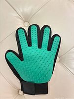 Front view showing green silicone nubbed palm and wrist strap