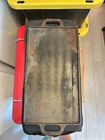 Flat griddle side with handles visible