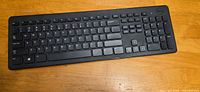 Slim black full-size keyboard with chiclet keys