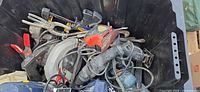 Overview of tote showing assorted power tools and clamps