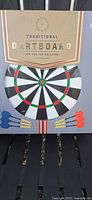 Front of unopened Gentlemen's Hardware Traditional Dartboard box showing dartboard image and darts