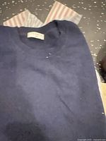 Navy crewneck sweater with Vince tag visible