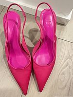 Fuchsia sling-back pointed-toe stilettos