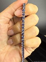Bracelet held vertically showing gemstone line