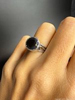 Ring worn on hand showing stone and setting