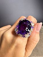 Ring on hand showing scale and gemstone details