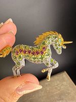 Front view of unicorn brooch showing gemstone layout
