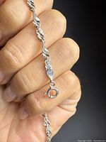 Close-up of bracelet clasp showing 925 stamp