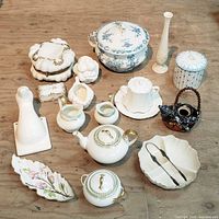 Group shot of all porcelain and pottery items on table