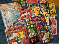 Overall view showing majority of vintage cartoon comics bagged and boarded