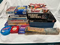 Full lot overview showing stacked board games, card games and puzzles