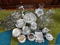 Entire assortment laid out showing china and glass pieces