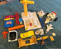 Overview of entire lot showing base, vehicles, shuttle, rocket pieces and accessories