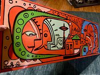 Close-up left section with signature and vivid color detailing