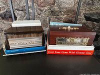 Both radio units on packaging showing exterior woodgrain cases and branding sleeves