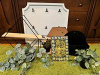 Group shot showing all wall décor items and faux plants