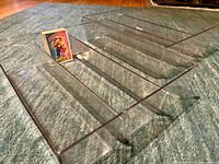 Top view of a clear plastic tray showing five compartments and scale card