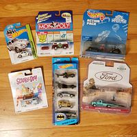 Group shot of all six sealed die-cast packages