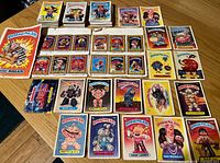 Overall view of assorted Garbage Pail Kids cards, jumbo card and sticker sheets