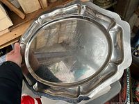 Front view showing full oval platter with scalloped rim and etched turkey