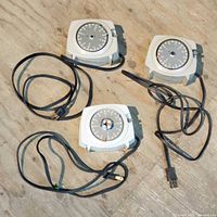 Front view of three Intermatic Time-All timers with cords