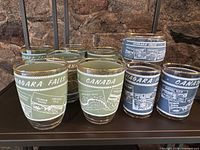 Group of green and blue frosted tumblers on shelf