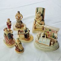 Group shot of seven Sebastian Miniatures on white backdrop