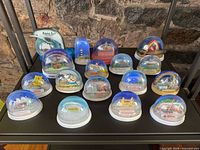 All 17 snow globes on shelving