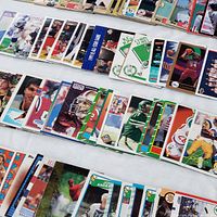Rows of assorted sports trading card magnets displayed face up