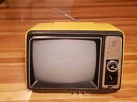 Front view showing screen, control panel and yellow case