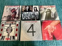 Six vinyl album covers laid out for identification