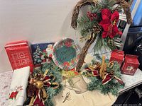 Lot overview showing plates, napkins, greenery decor, LED boxes