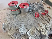 Overview of entire lot showing placemats, ribbon spools, glitter pick stems