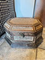 Full view of closed octagonal box showing inlay and latch