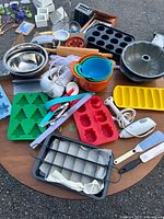 Overview of assorted bakeware and utensils on table