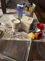 Group of canisters, tumblers, utensil holder, glass bakeware, silicone funnels