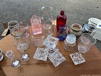 Overall view of assorted glass vases, crystal and ceramic candleholders