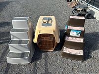 Group view of carrier and two pet stair sets on ground