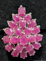 Top view of ruby cluster ring showing stone arrangement and prong settings