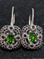 Front view of both earrings highlighting stones and metalwork