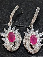 Front view of both silver ruby CZ earrings