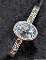 Top view showing oval blue topaz and marcasite shoulders