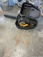 Chainsaw inside open plastic case