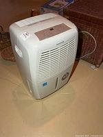 Front and side view of Honeywell dehumidifier showing overall condition and size