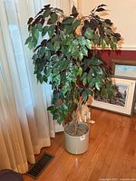 Full view of artificial tree in planter